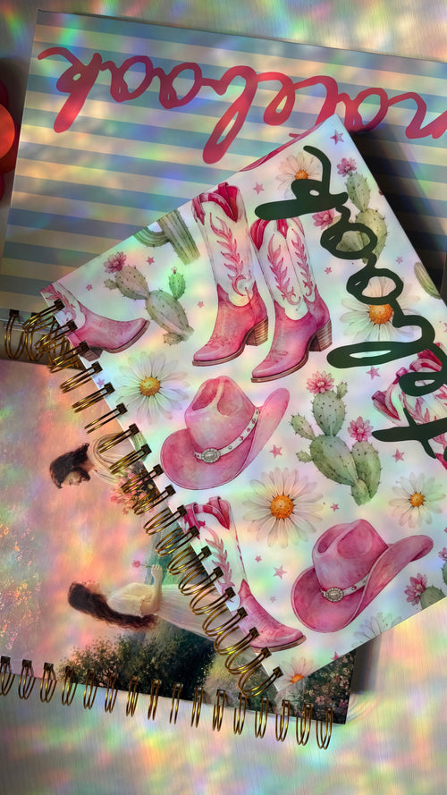 Notebook with cowboy boot and cactus design on a colorful background